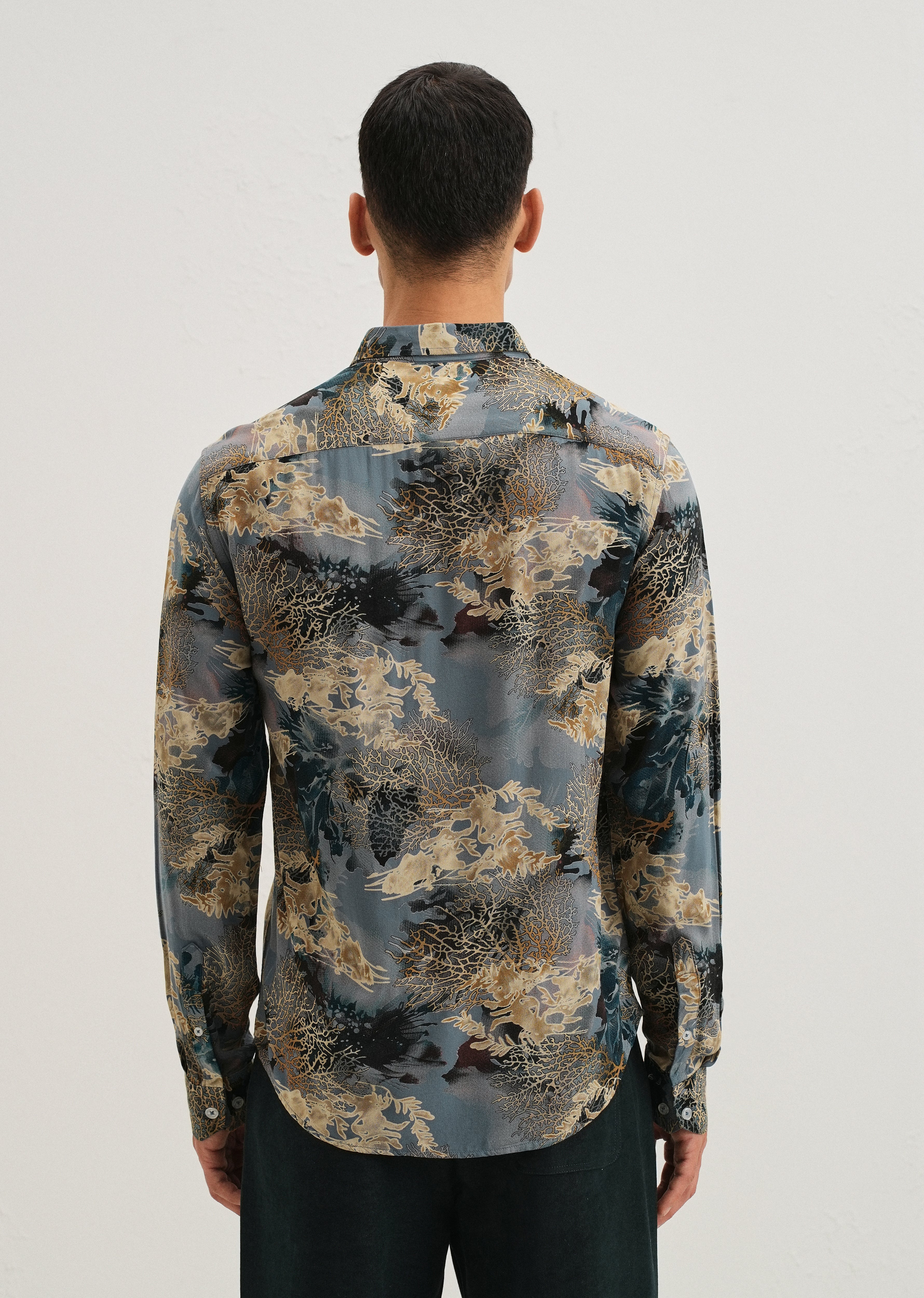 Coral Oasis Light Blue Feather shirt