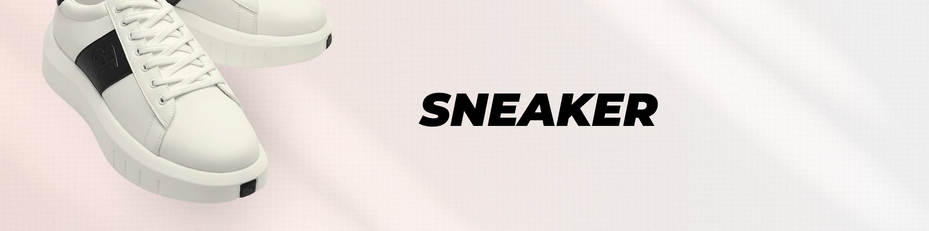 White low-top sneakers with black side panels, shown on a pale pink background with the word 'SNEAKER' in bold black text.
