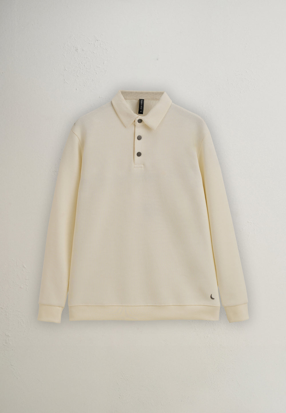 Beige long-sleeve polo shirt on a light gray background