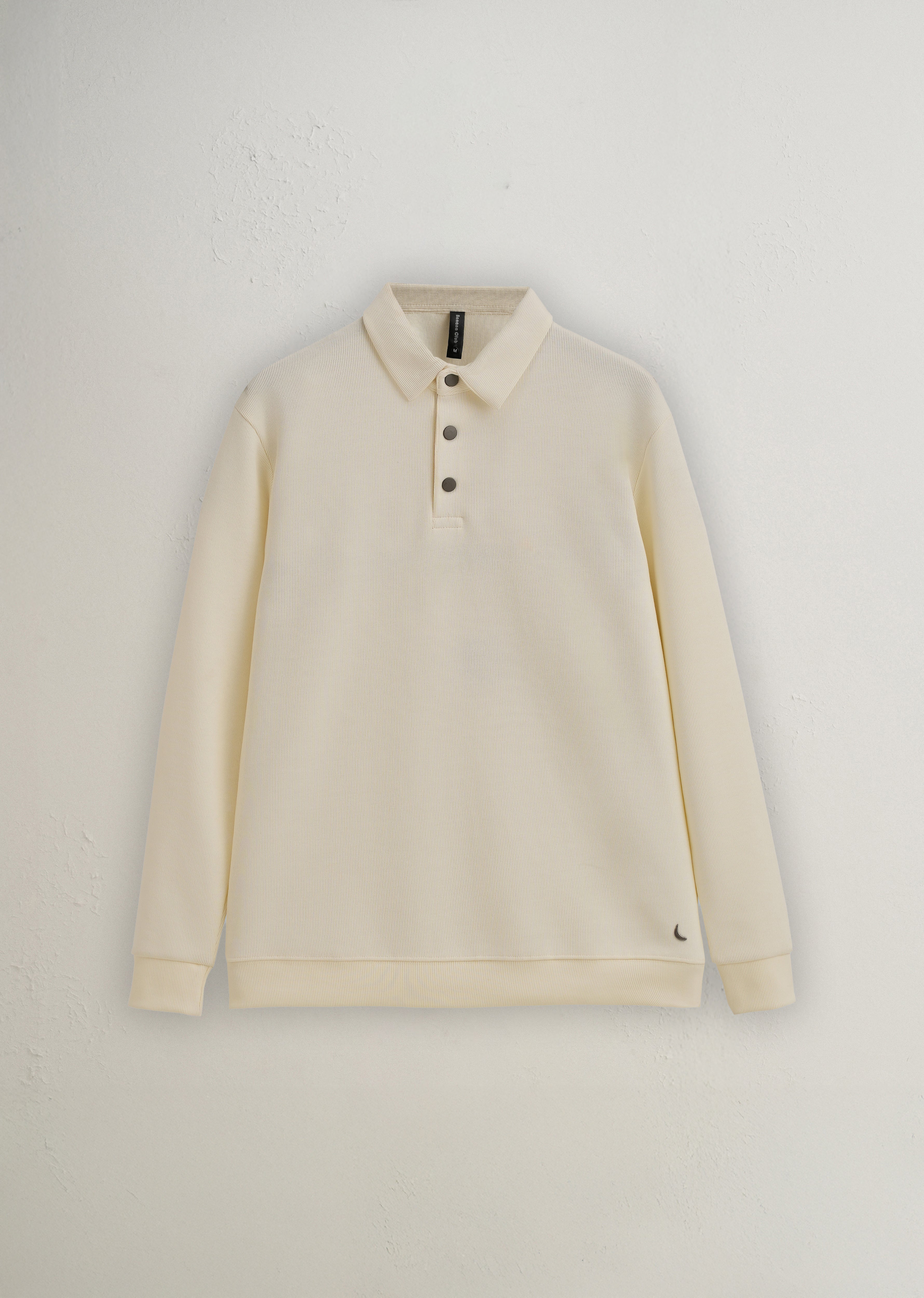 Beige long-sleeve polo shirt on a light gray background