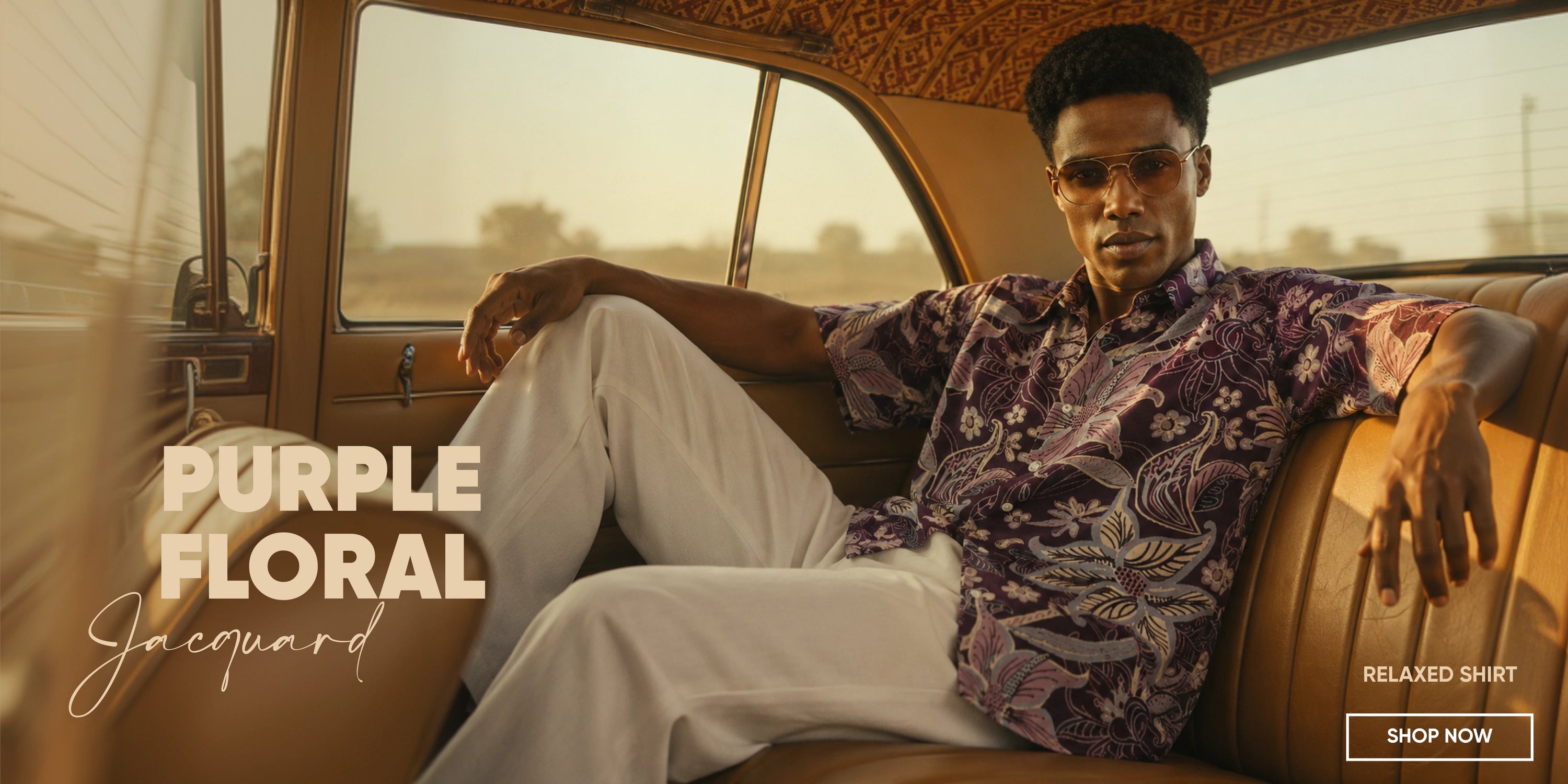 Man sitting inside a vehicle wearing a purple floral shirt and white pants, with text overlay about clothing.