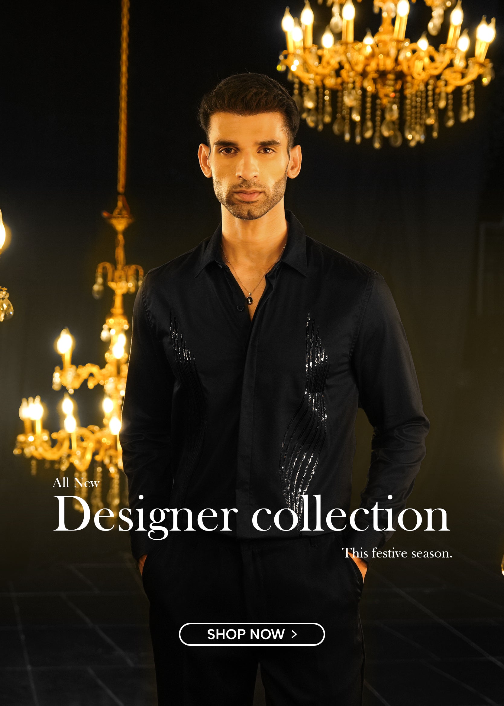 Man in a black shirt standing in front of chandeliers with text about a designer collection.