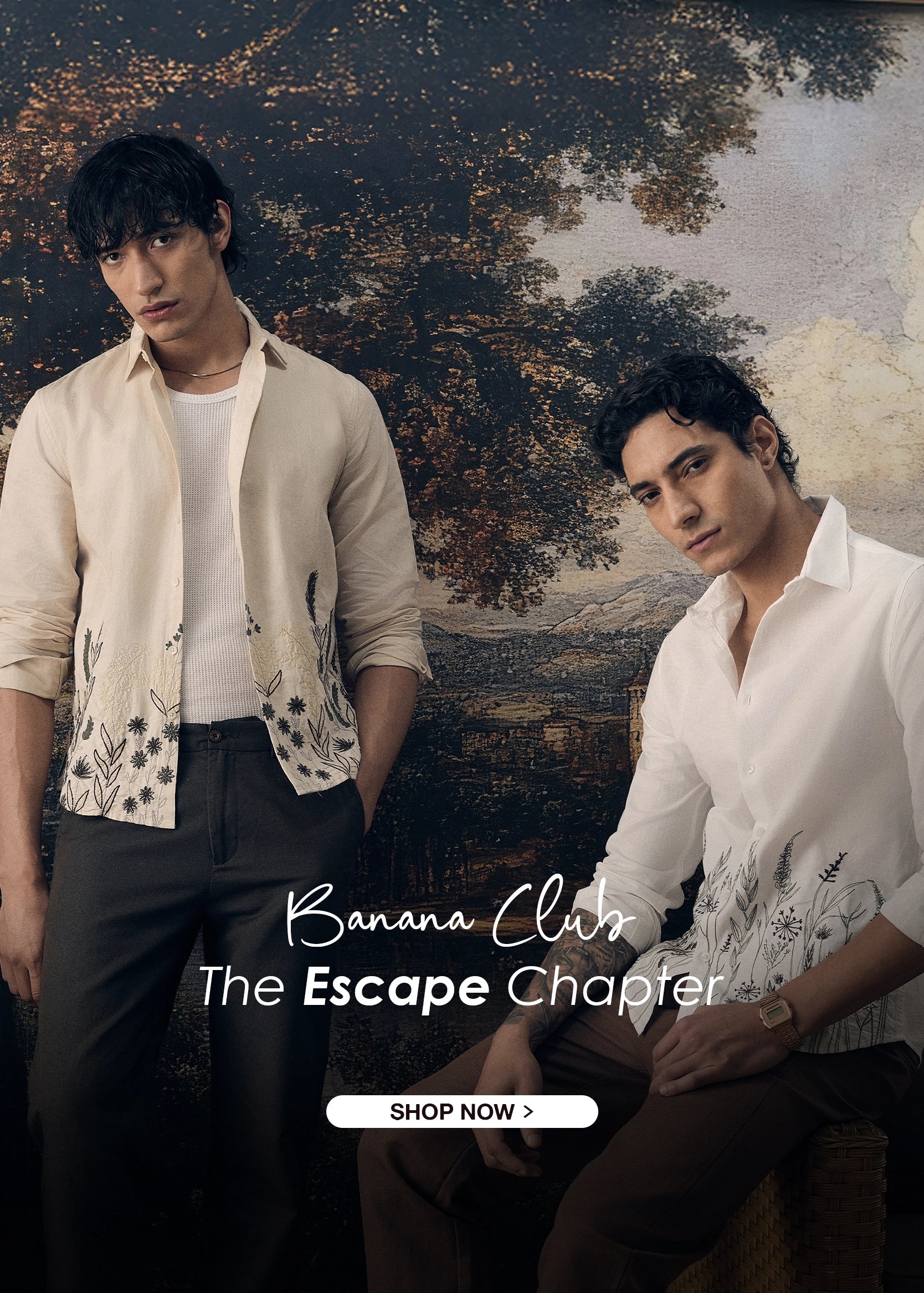 Two men standing in front of a scenic background with 'Banana Club' branding.