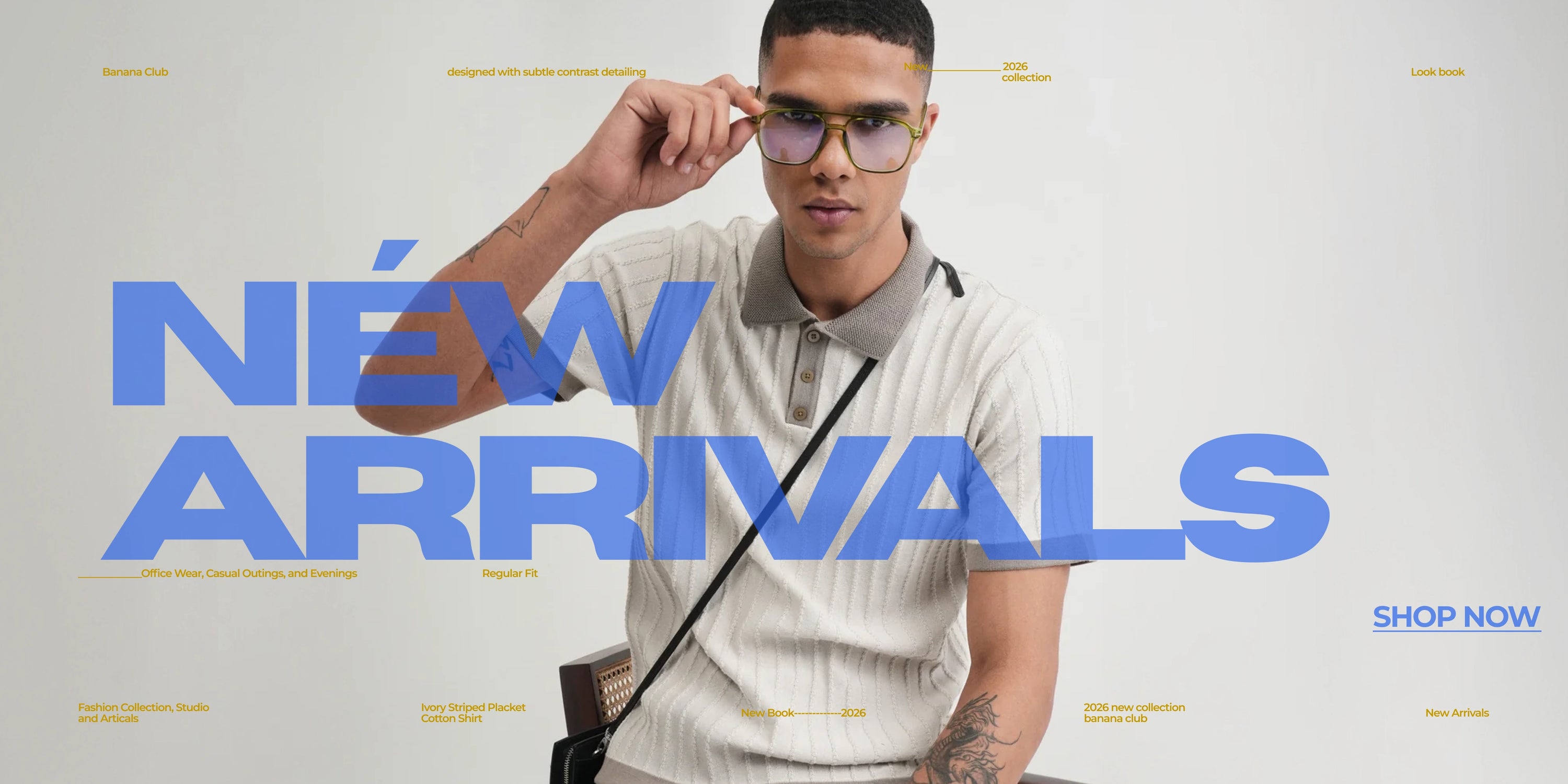 A man wearing a light beige striped polo shirt and round eyeglasses with gold frames, holding the glasses to his forehead. Large blue text reads 'NEW ARRIVALS' on a light gray background, with small yellow text labels around the image and a 'SHOP NOW' button in the bottom right.