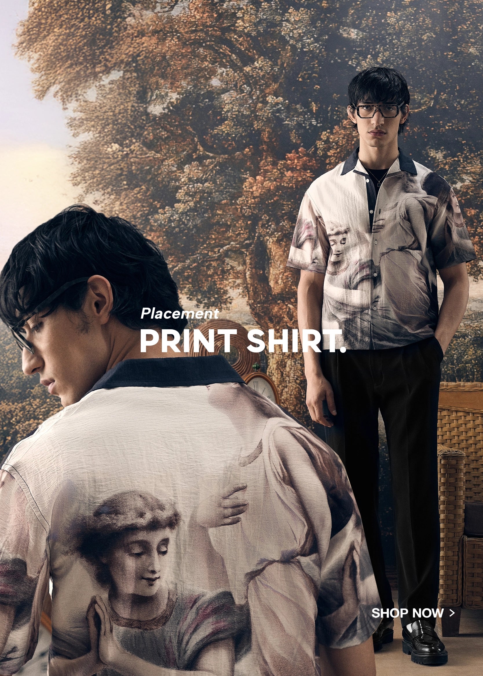 Two men wearing printed shirts with a scenic background