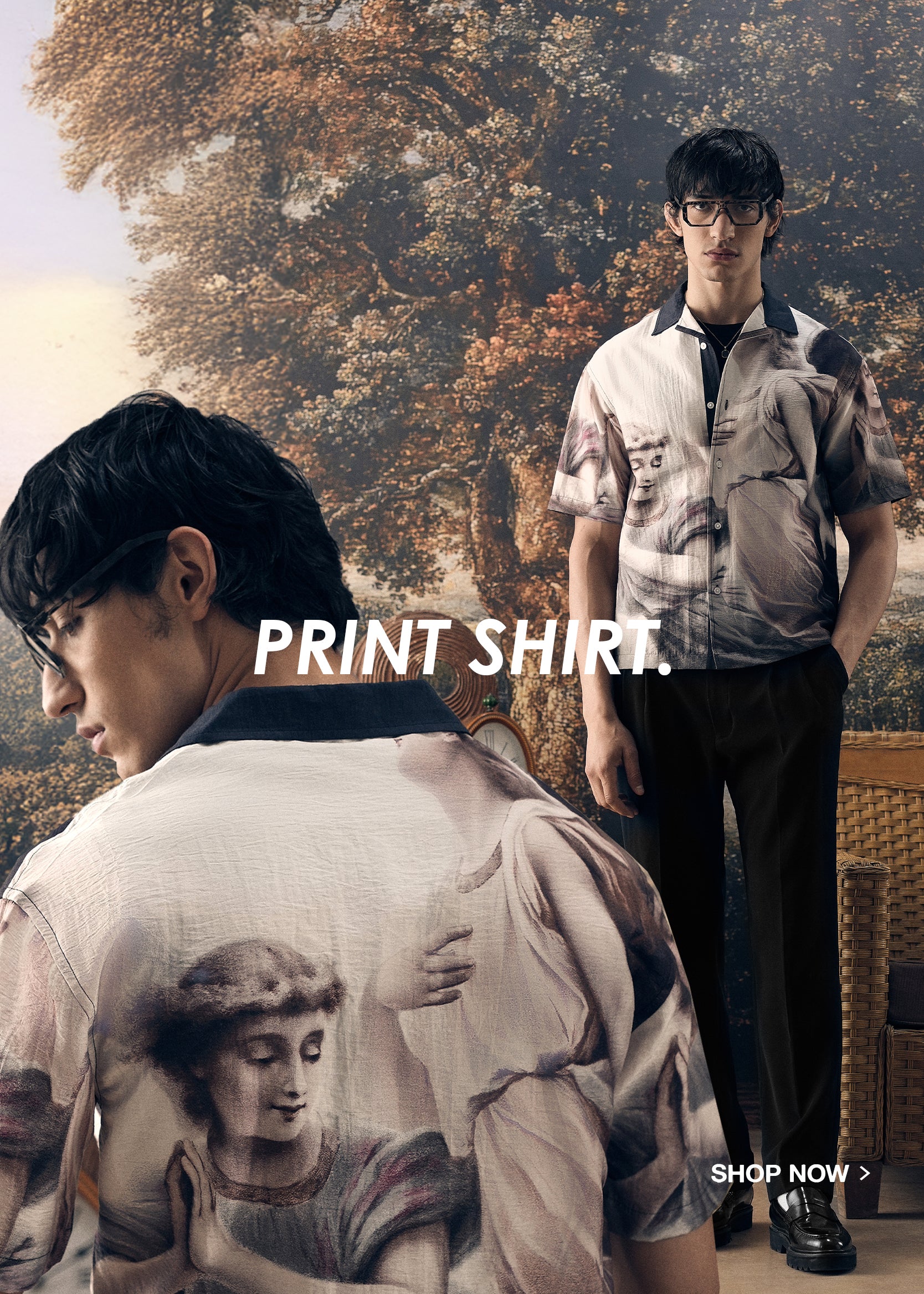 Two men wearing printed shirts with artistic designs in a casual setting.